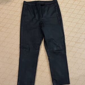 Women’s real leather trousers. Zip and tab close.